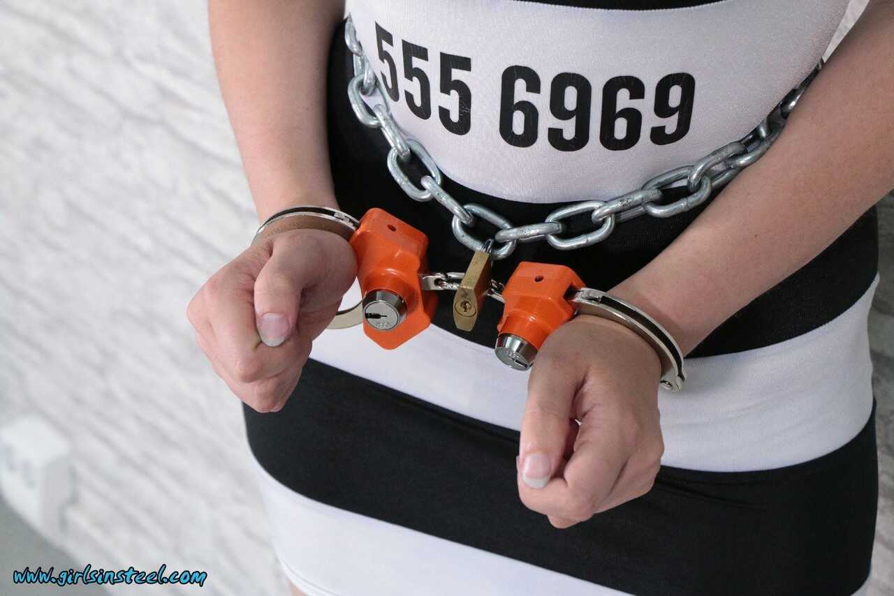 Dyed-haired White Girl Bound in Chains and Security Cuffs, Forced to Serve Her BDSM Master in High Heels - 