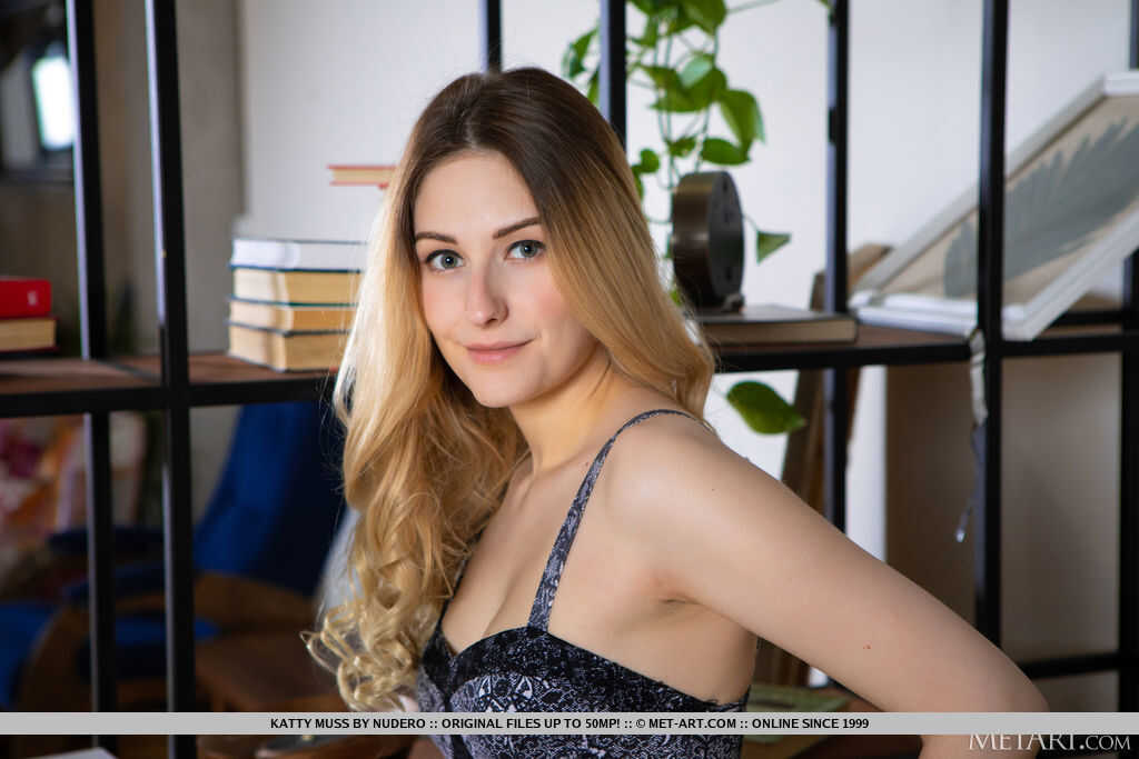 Blonde teen Katty Muss strips down for a sexy nude photo shoot, exposing her beautiful natural tits and shaved pussy for t...