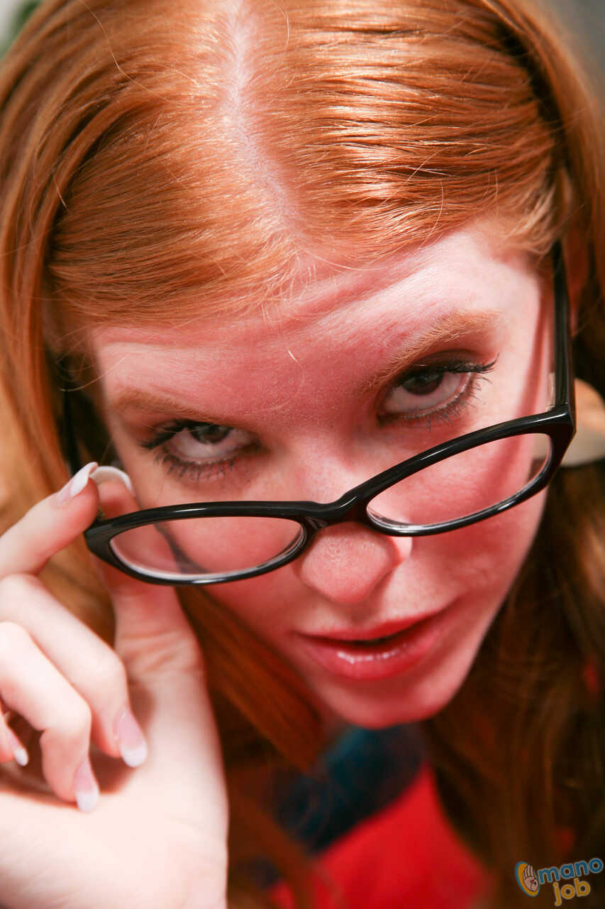 Natural redhead April Turner wears cum on glasses after jerking on a penis: A nerdy fantasy come true! - April Turner