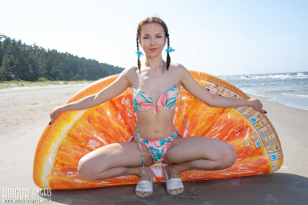 Nesti's Public Nudity: A Skinny Teen's Nude Play on the Beach with Her Pigtails - Nesti