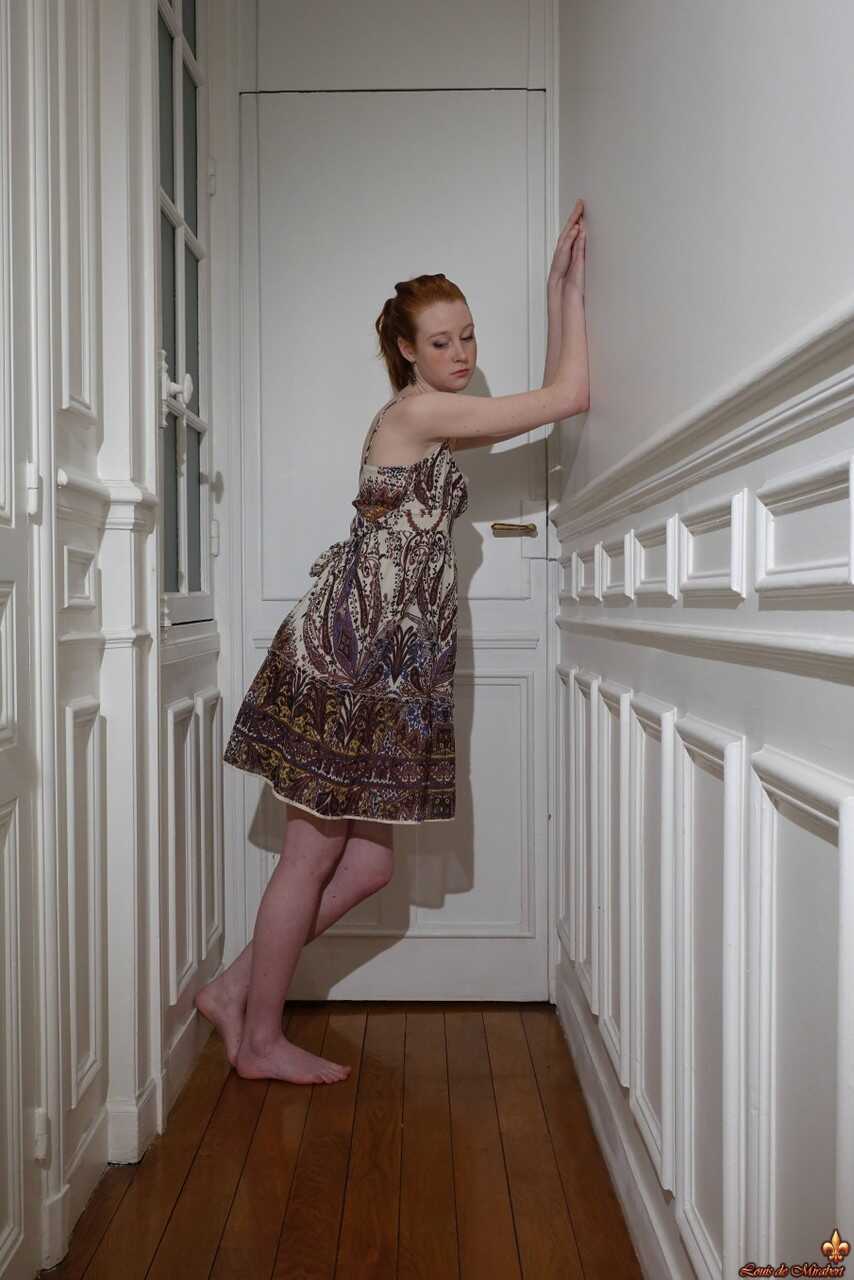 Nathalie Lawson's Upskirt Exposé: A Hallway Encounter with a Pale Redheaded Beauty