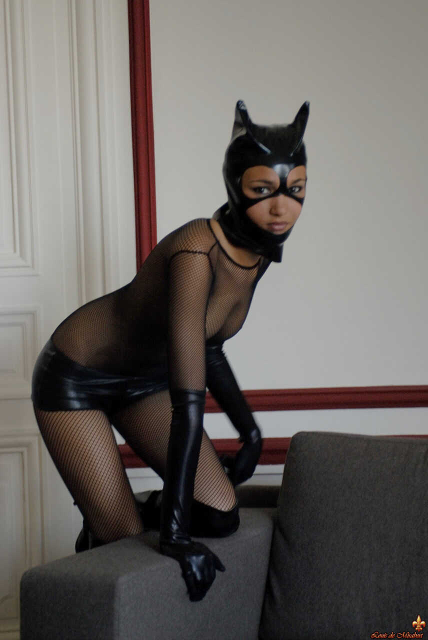 Brazilian Mature Angelique poses in a sexy Catwoman outfit while teasing her pantyhose-clad pussy for your pleasure! - Ang...