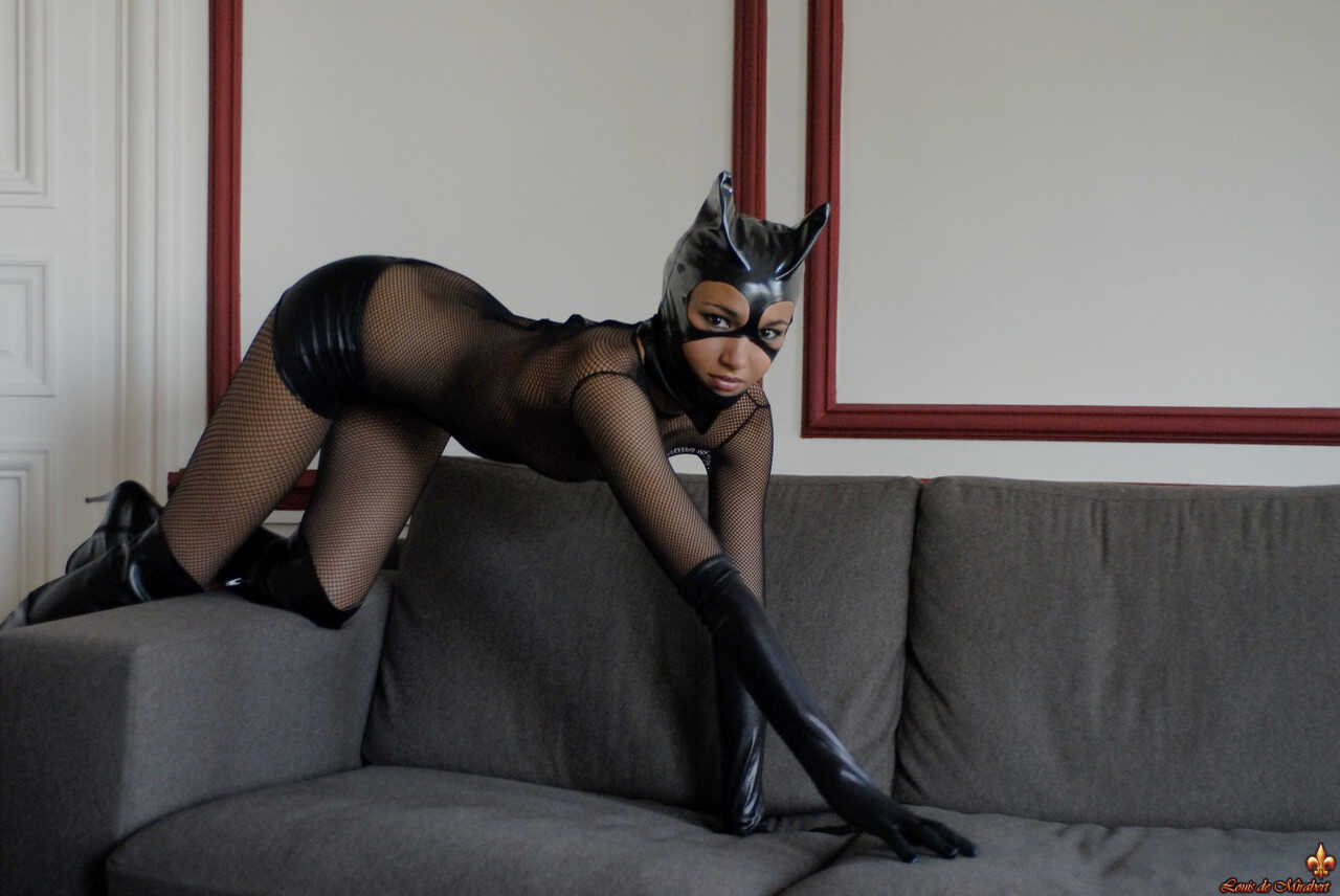 Brazilian Mature Angelique poses in a sexy Catwoman outfit while teasing her pantyhose-clad pussy for your pleasure! - Ang...