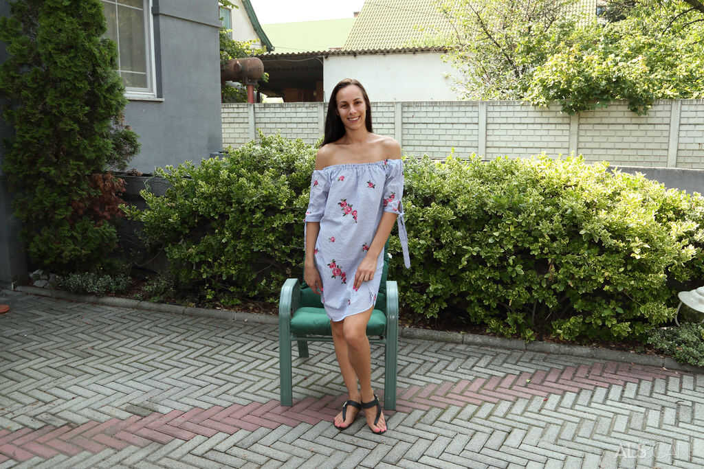 Amateur chick Cayenne Hot takes a piss in the driveway after toying with her asshole - Cayenne Hot