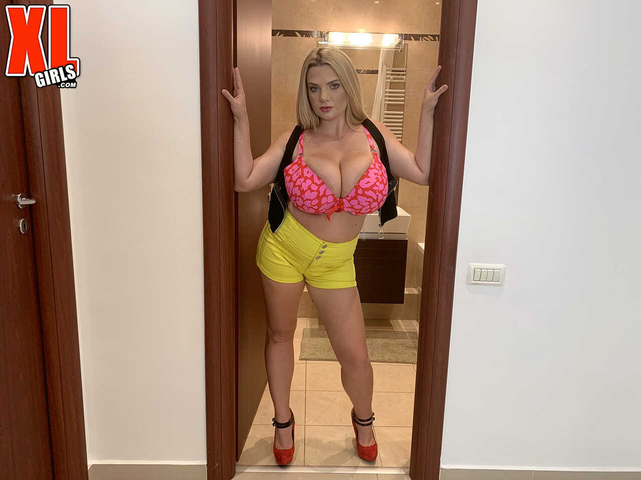 Chubby blonde Kitty Cute strips off her bra and panties, revealing her huge tits! - Kitty Cute