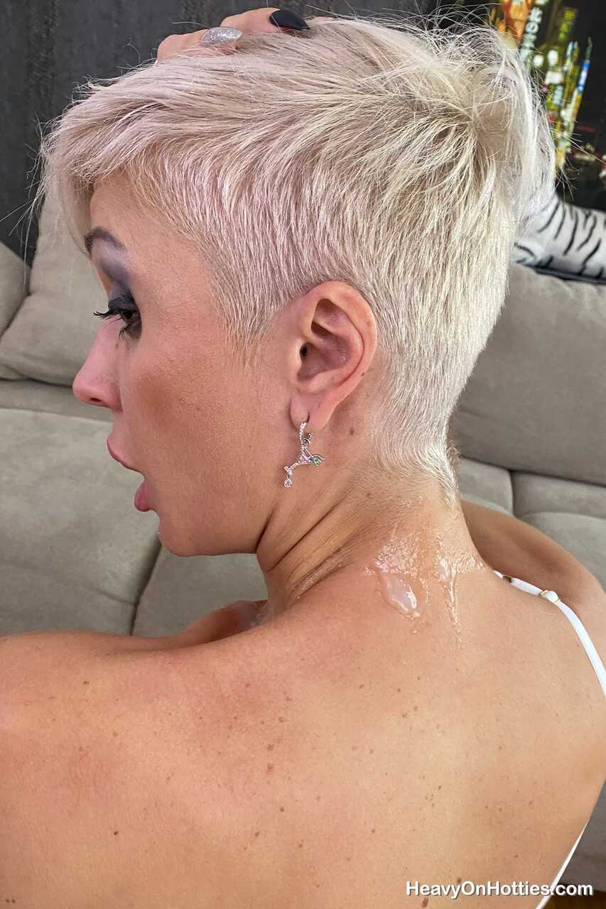 Inked platinum blonde Tanya Virago holds a cock after showing her pierced cunt to your satisfaction . - Tanya Virago