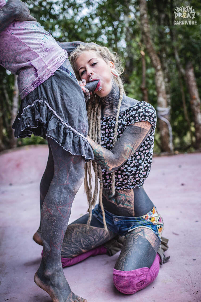 Heavily tattooed girl Lily Lu sucks on her boyfriend's tattooed penis while enjoying the nude beach with her tattooed...