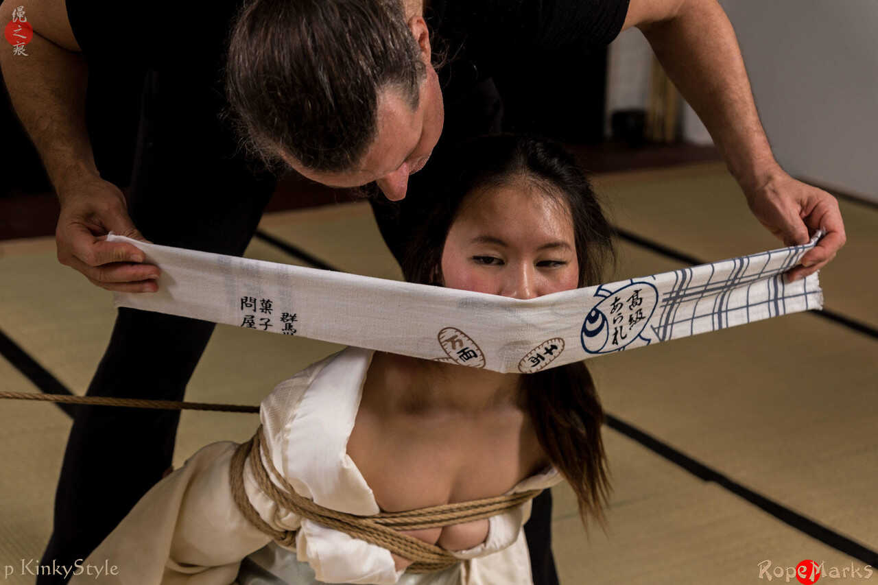 Japanese female Flawless Meow is gagged during a Shibari session