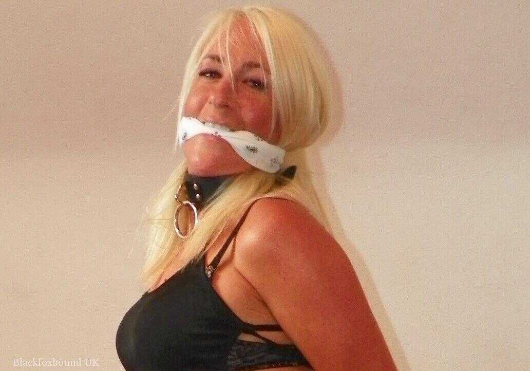 Gagged and Tied-Up Blonde MILF in a Denim Miniskirt