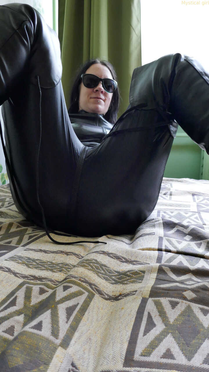 Dark haired beauty in leather outfit seductive poses - 