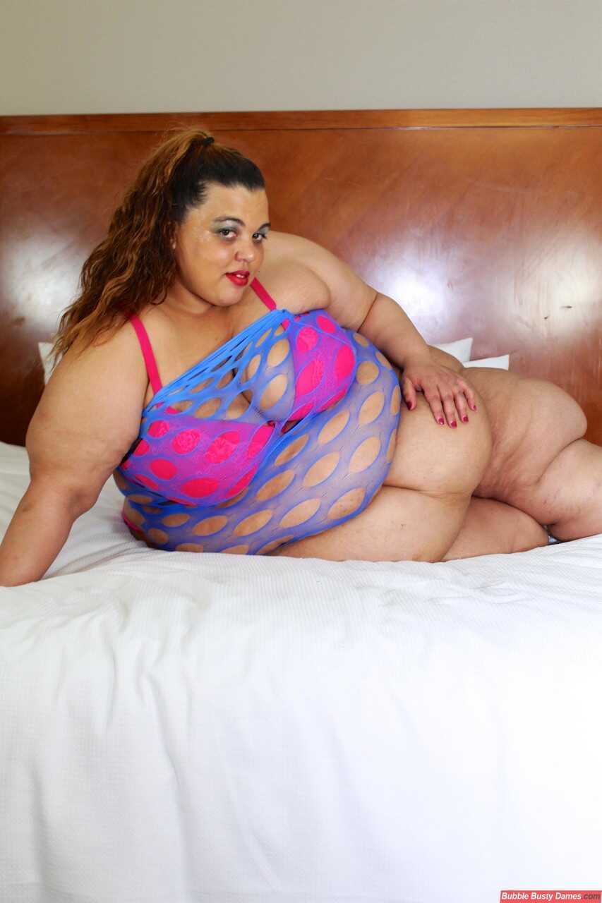 SSBBW Golden Bombshell shows her huge ass on a bed in thong underwear while wearing lingerie - Golden Bombshell