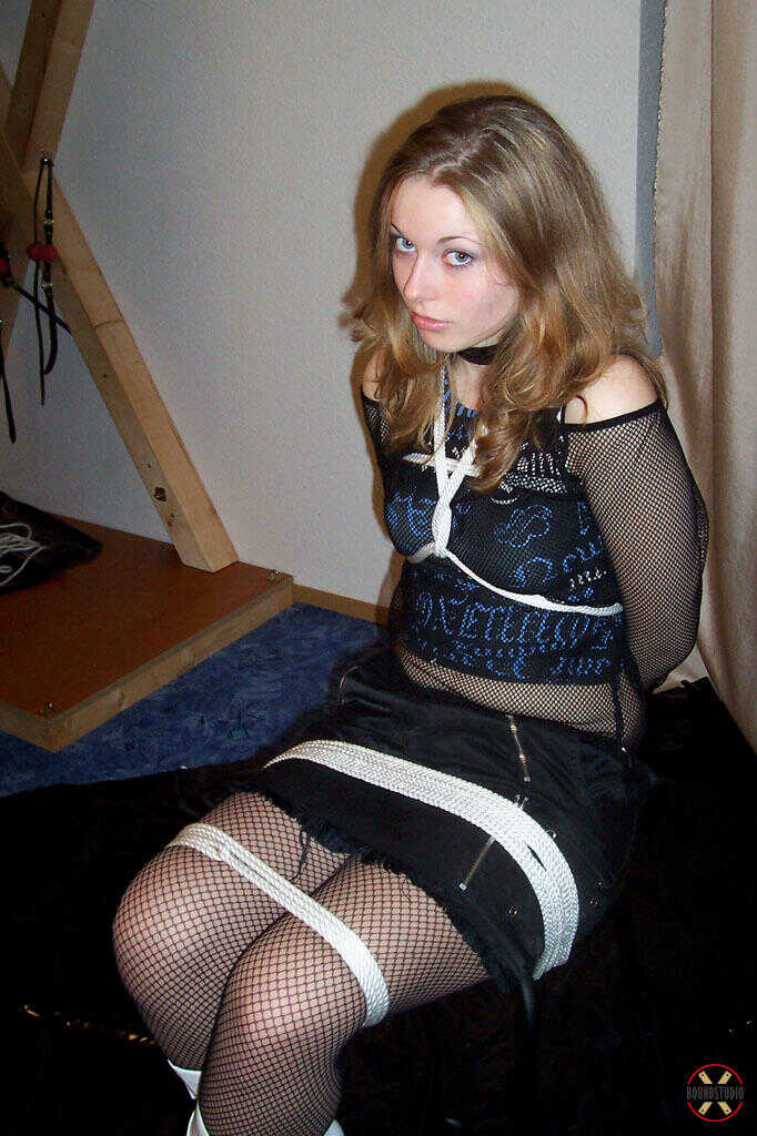 Bondage Beauty in White Boots and a Sexy Leather Skirt