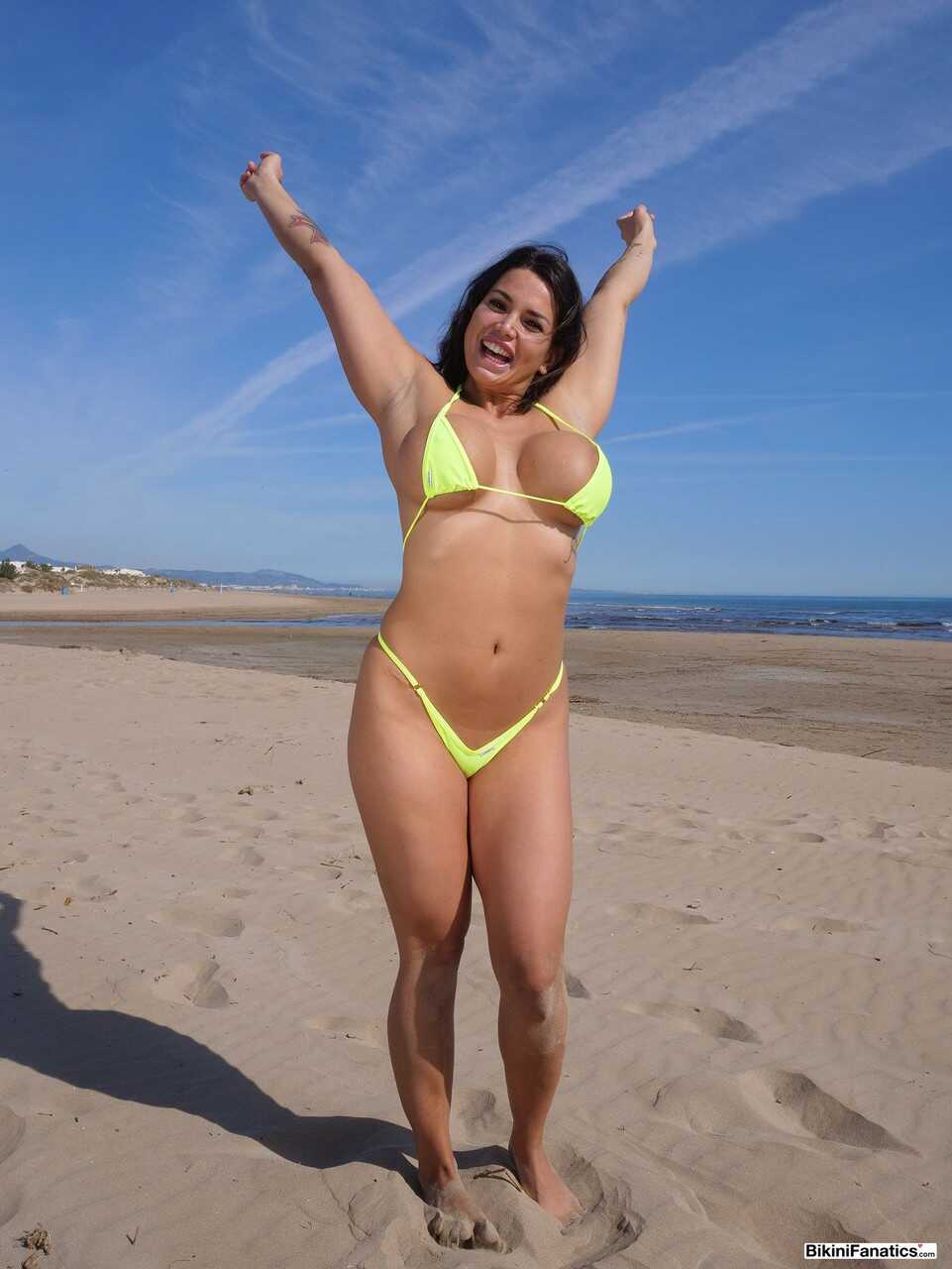 Curvy girl Chloe Lamour's perfect body sets her big fake tits free of a micro bikini at the beach - Chloe Lamour
