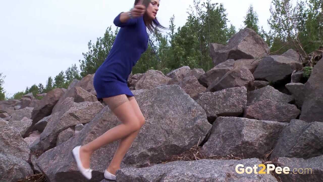 Pussy to Pebbles: Caucasian Girl Kristina Squats for a Public Piss on Boulders in Flat Shoes