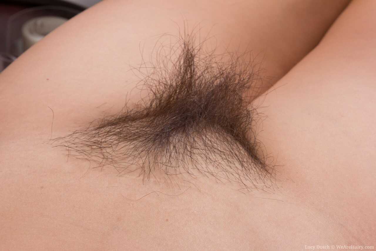 Nerdy brunette Lucy Dutch's hairy pussy and ass spread for the camera after getting undressed - Lucy Dutch