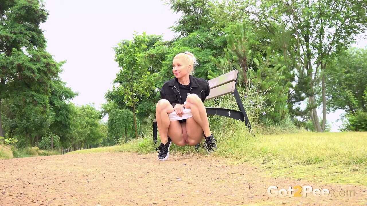 Blonde Girl Takes A Walk Through The Park And Squats For A Public Pee In Front Of Everyone!