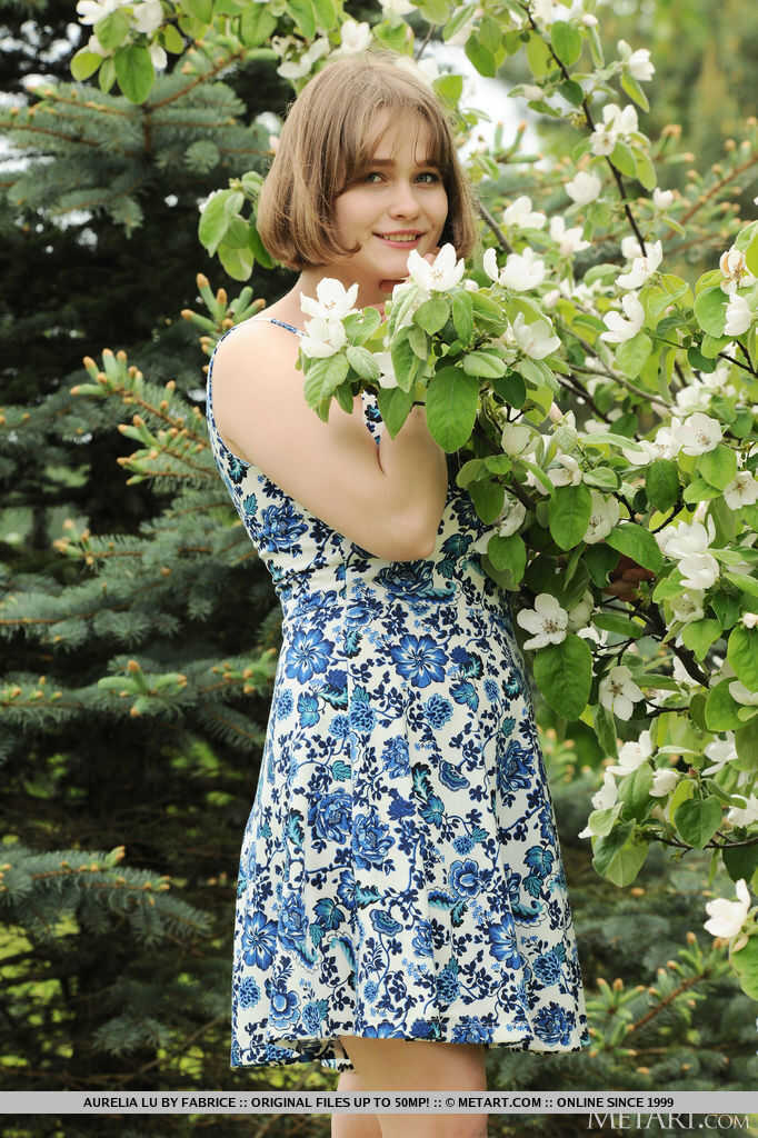 Big titted teen Aurelia Lu sniffs flowers before getting totally naked outside on a sunny day. - Aurelia Lu