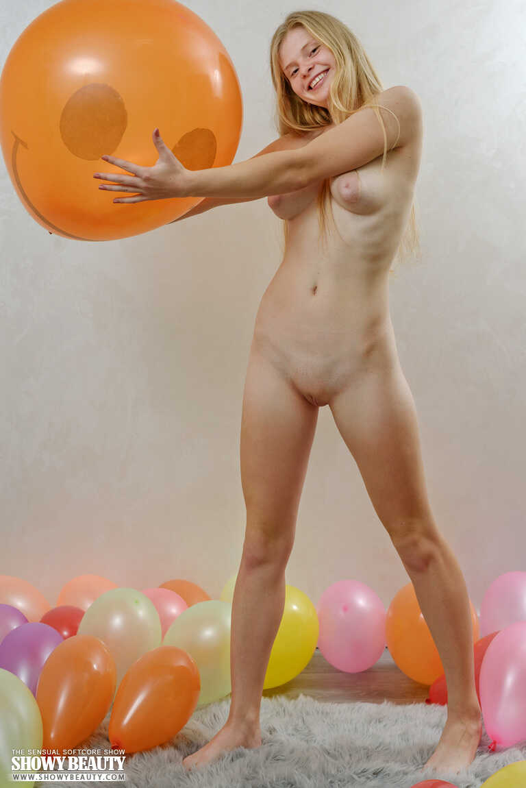 Young looking blonde Agust D holds a balloon during a totally nude session - Agust D