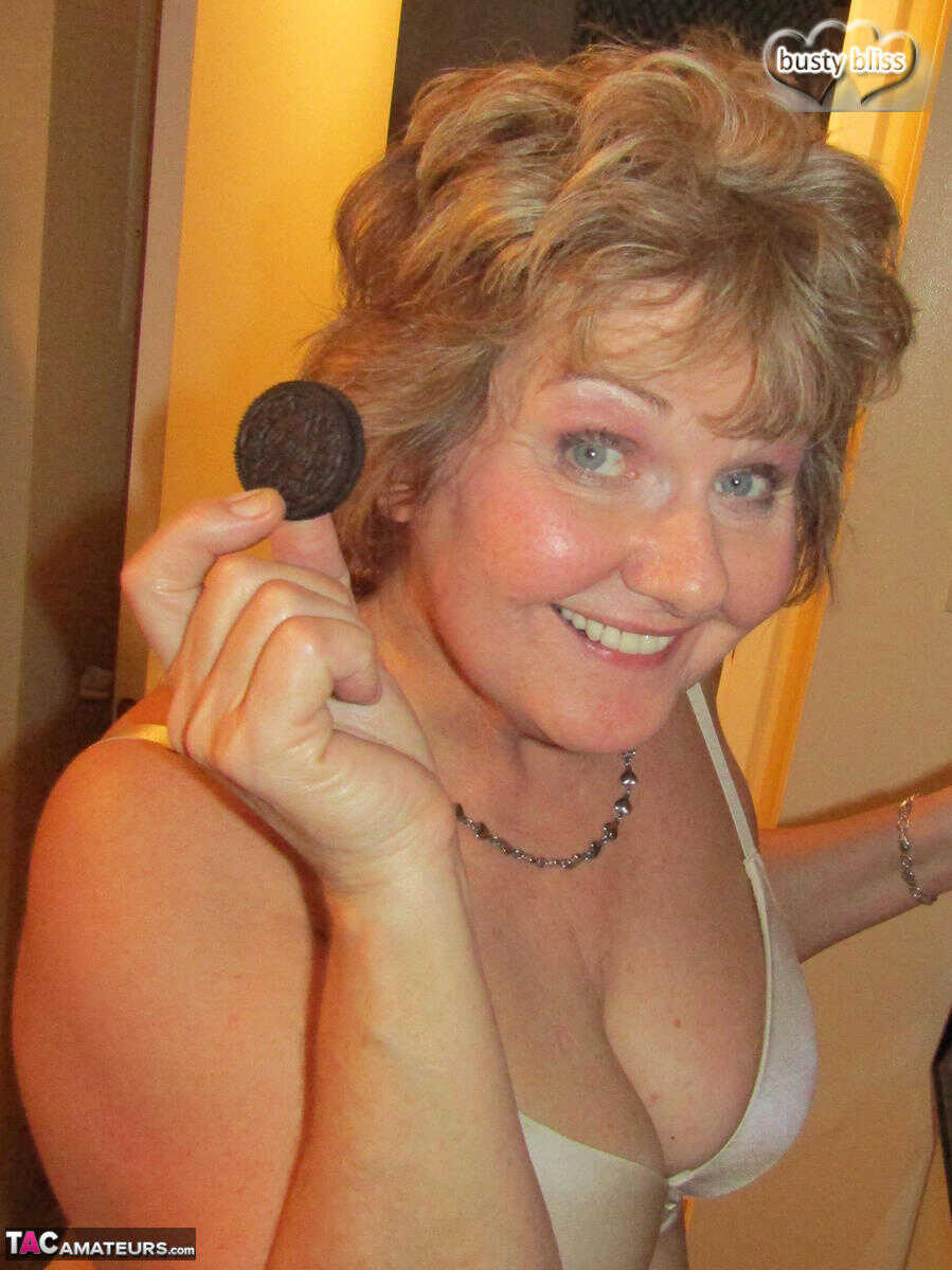 Mature woman Busty Bliss uncovers her natural boobs before pleasuring a penis with the help of her granny's lingerie ...