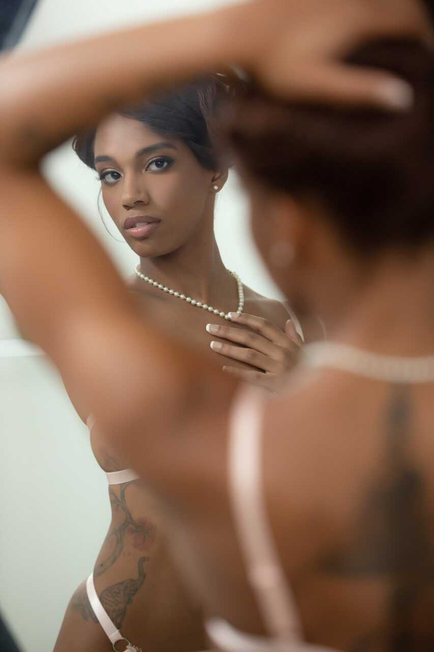 Beautiful ebony goddess Lacey London gets naked in front of a mirror and admires her perfect pussy and sexy black ass!