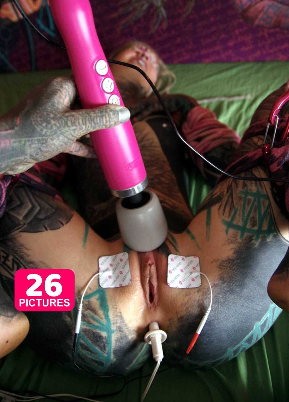 Heavily tattooed Anuskatzz masturbates with a pierced pussy while waiting for a big black cock