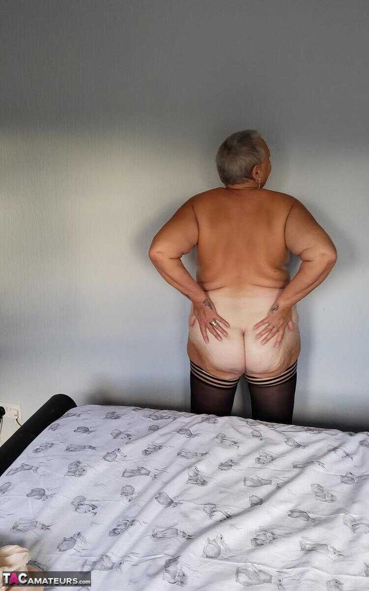Huge boobs, sagging skin and a shaved pussy: Overweight granny Valgasmic Exposed bares it all in her lingerie and hosiery....