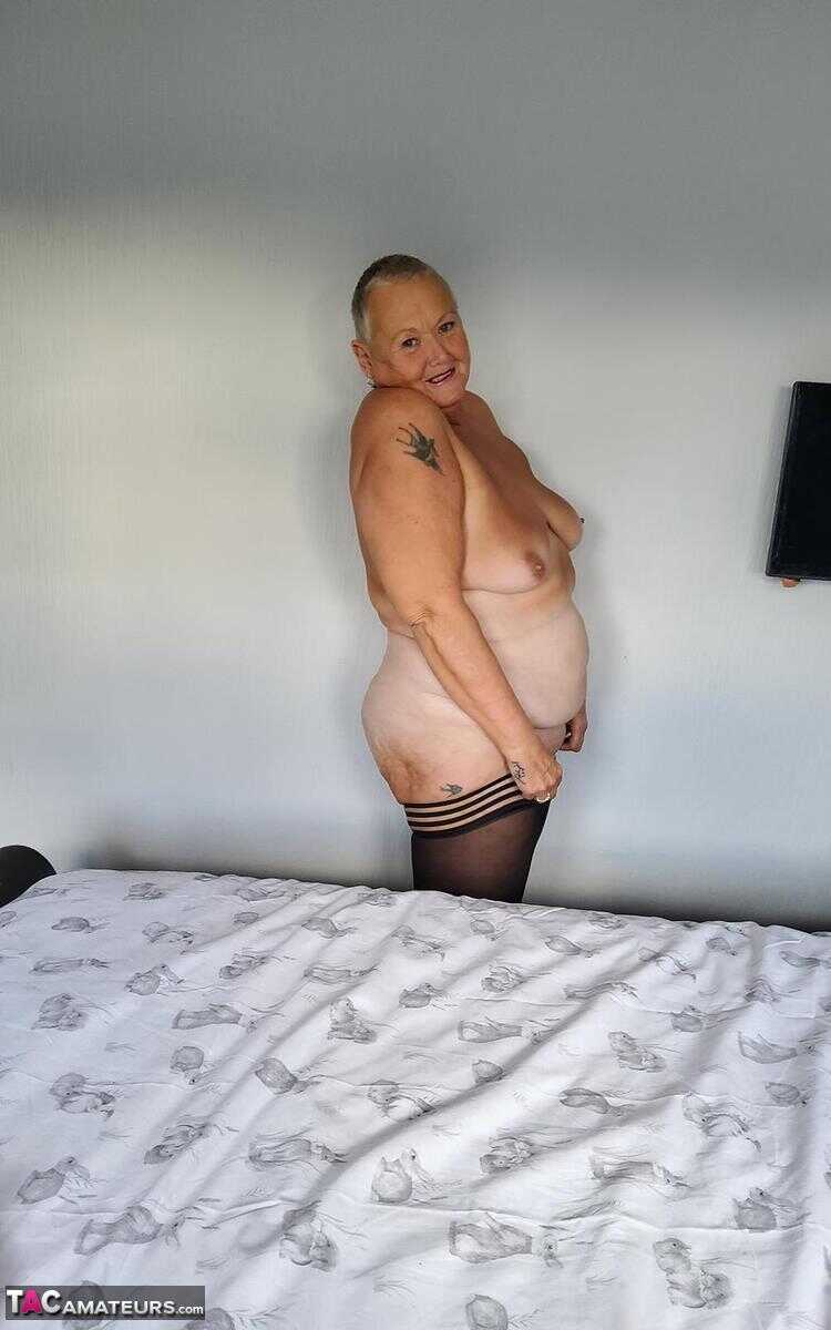 Huge boobs, sagging skin and a shaved pussy: Overweight granny Valgasmic Exposed bares it all in her lingerie and hosiery....