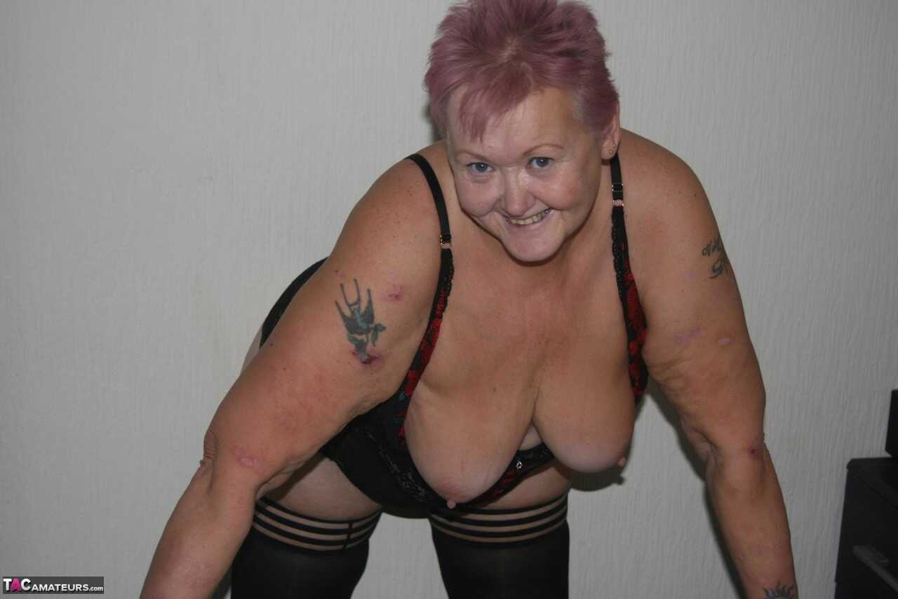 Huge boobs, sagging skin and a shaved pussy: Overweight granny Valgasmic Exposed bares it all in her lingerie and hosiery....