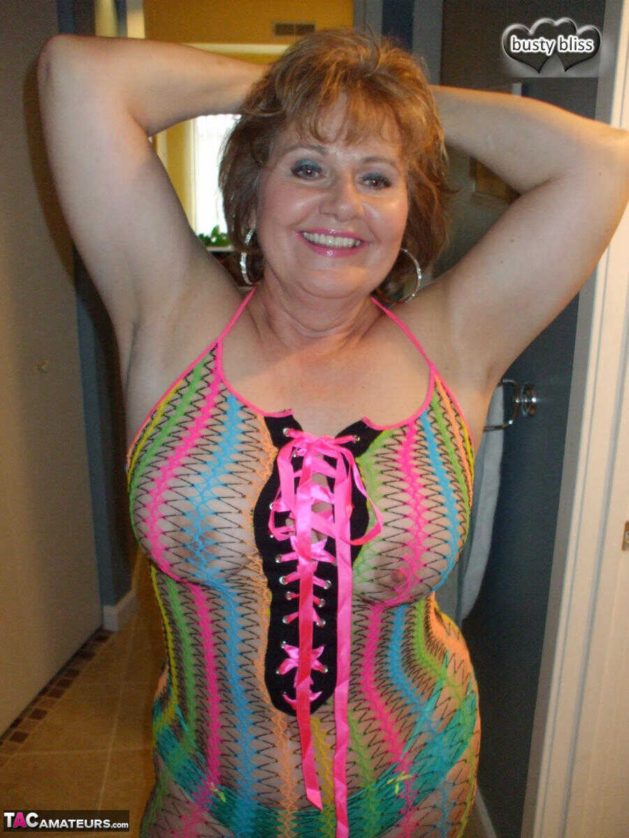 Redheaded Busty Bliss in a see-through dress, exposing her curvy granny pussy!