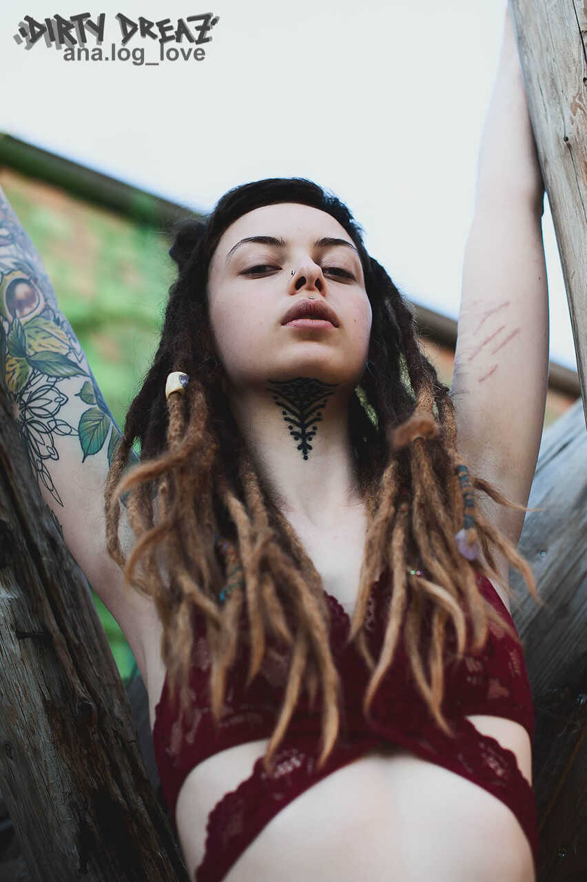 Tattooed female bodybuilder with dreadlocks gets naked in the woods for a solo show - Cutz