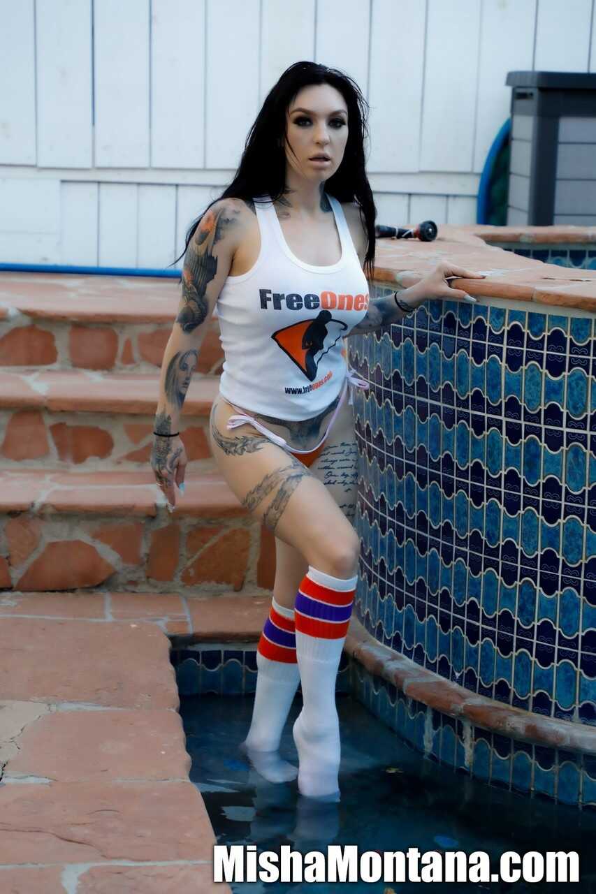 Misha Montana's Tattooed Brunette Beauty in Skimpy Tank Top and Knee-High Socks by the Poolside