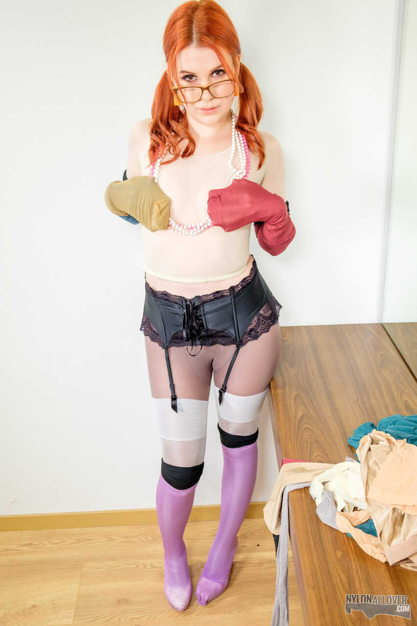 Pale redhead Kaira's sexy nerd look with glasses and nylons leaves us wanting more. - Kaira
