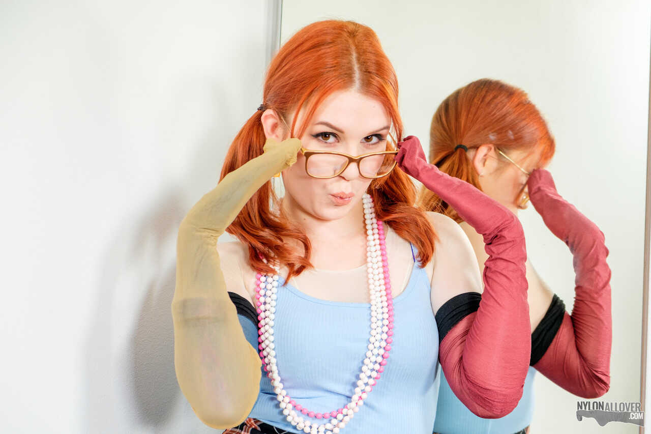 Pale redhead Kaira's sexy nerd look with glasses and nylons leaves us wanting more. - Kaira