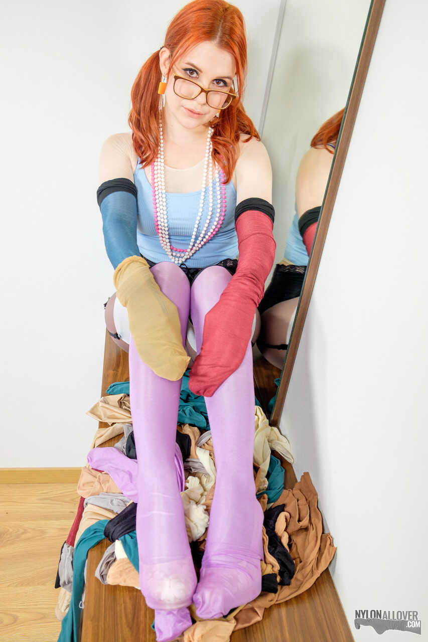 Pale redhead Kaira's sexy nerd look with glasses and nylons leaves us wanting more. - Kaira