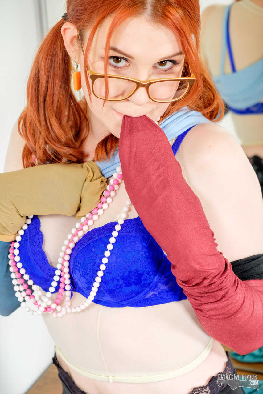 Pale redhead Kaira's sexy nerd look with glasses and nylons leaves us wanting more.