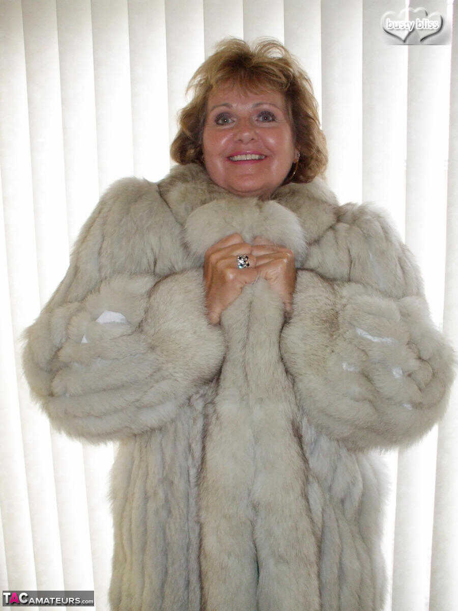 Curvy granny Busty Bliss looses her tan lined tits from a fur coat in a solo amateur session - Busty Bliss