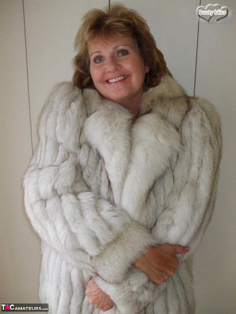 Curvy granny Busty Bliss looses her tan lined tits from a fur coat in a solo amateur session - Busty Bliss