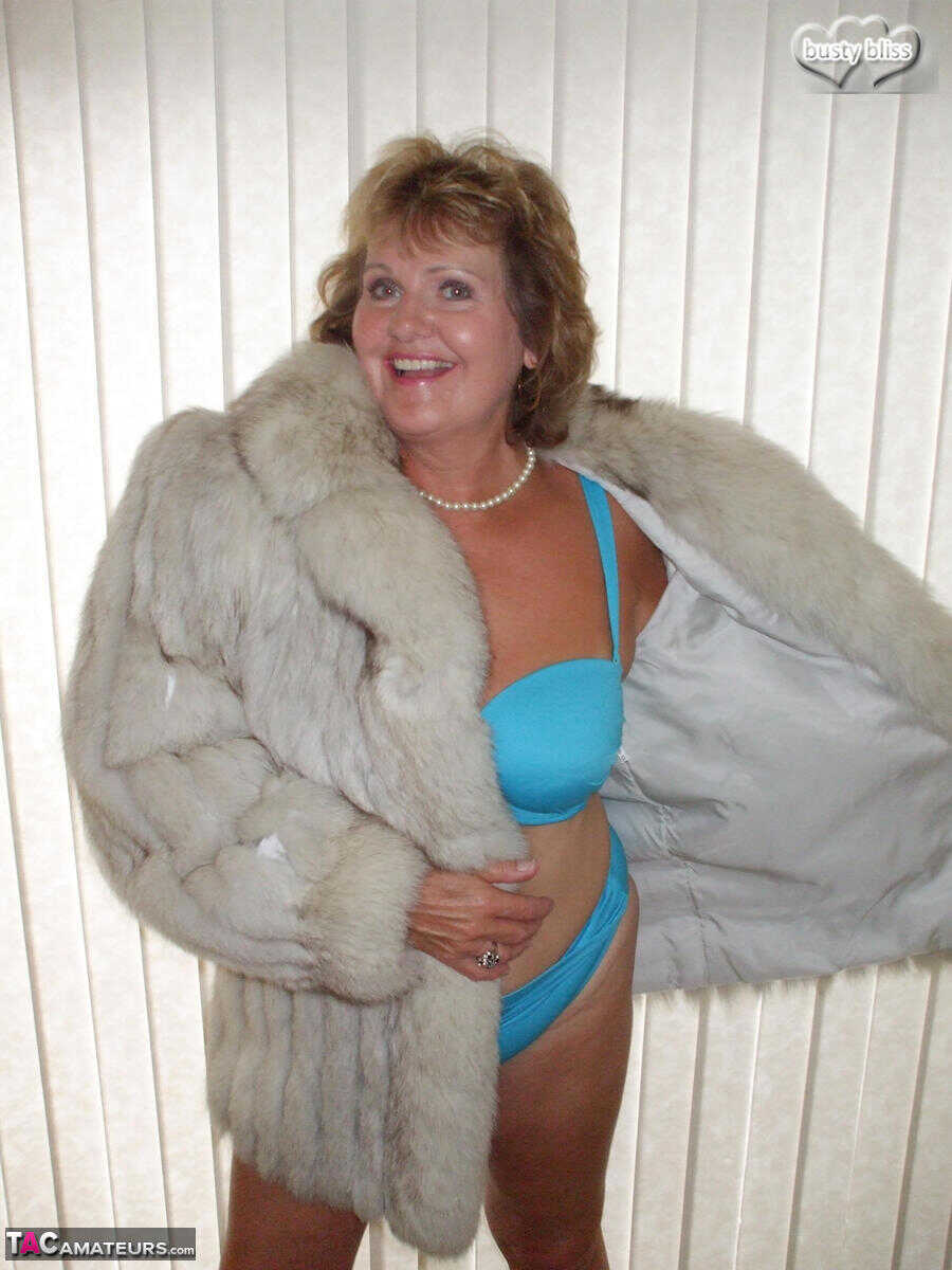 Curvy granny Busty Bliss looses her tan lined tits from a fur coat in a solo amateur session - Busty Bliss