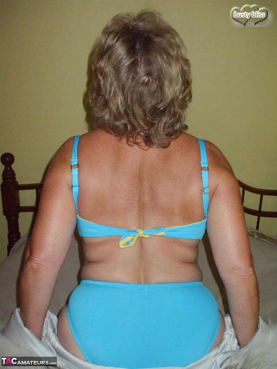Curvy granny Busty Bliss looses her tan lined tits from a fur coat in a solo amateur session - Busty Bliss