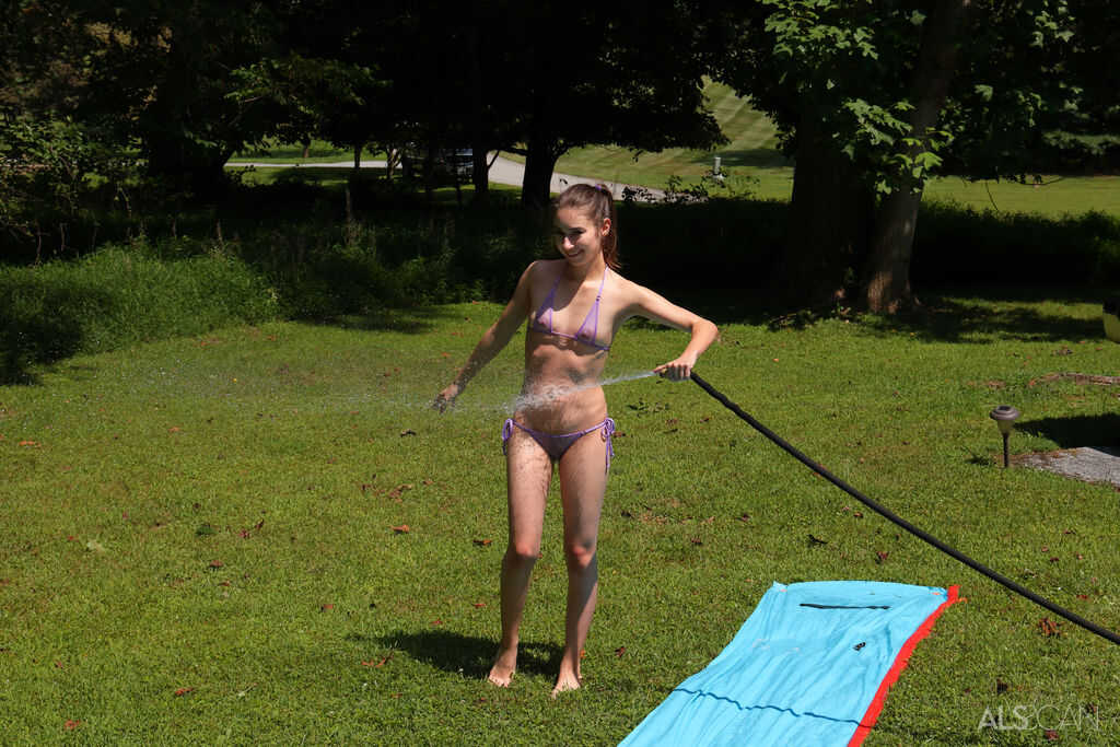 Naked Nicole Auclair Takes a Piss on a Water Slide in a Backyard: Teen Cameltoe and Bikini Adventure