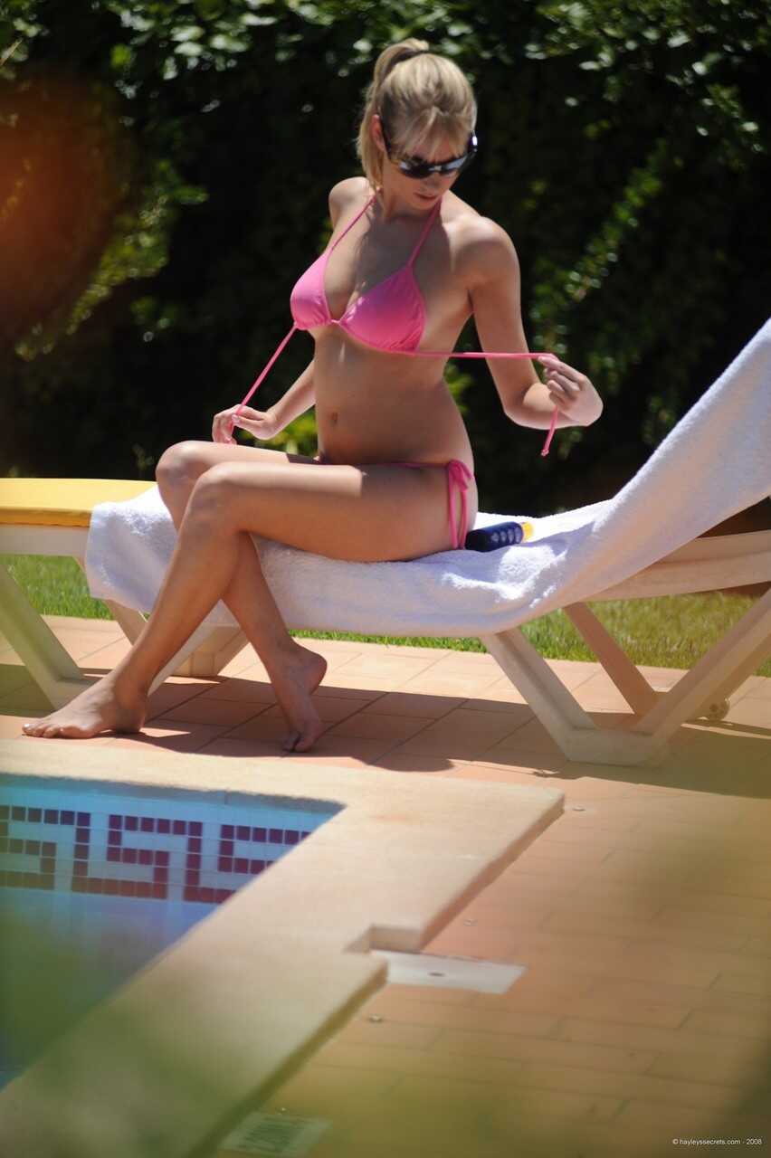 British amateur Hayley Marie Coppin covers her nice tits in suntan lotion while wearing a skimpy bikini on the beach - Hay...