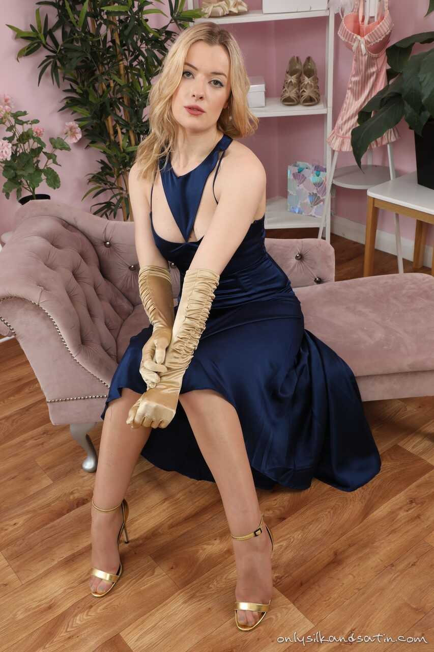 Behind the scenes with Grace Emily as she strips down to garters and nylons, teasing us with upskirt shots and spread legs...