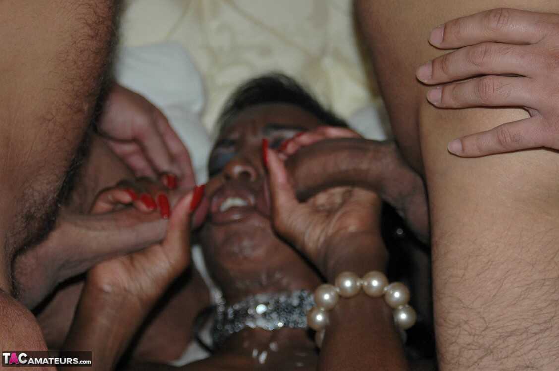 British slut Juicy Jo spills cum from her mouth during a gangbang on a bed with four black men and their mom. - Juicy Jo