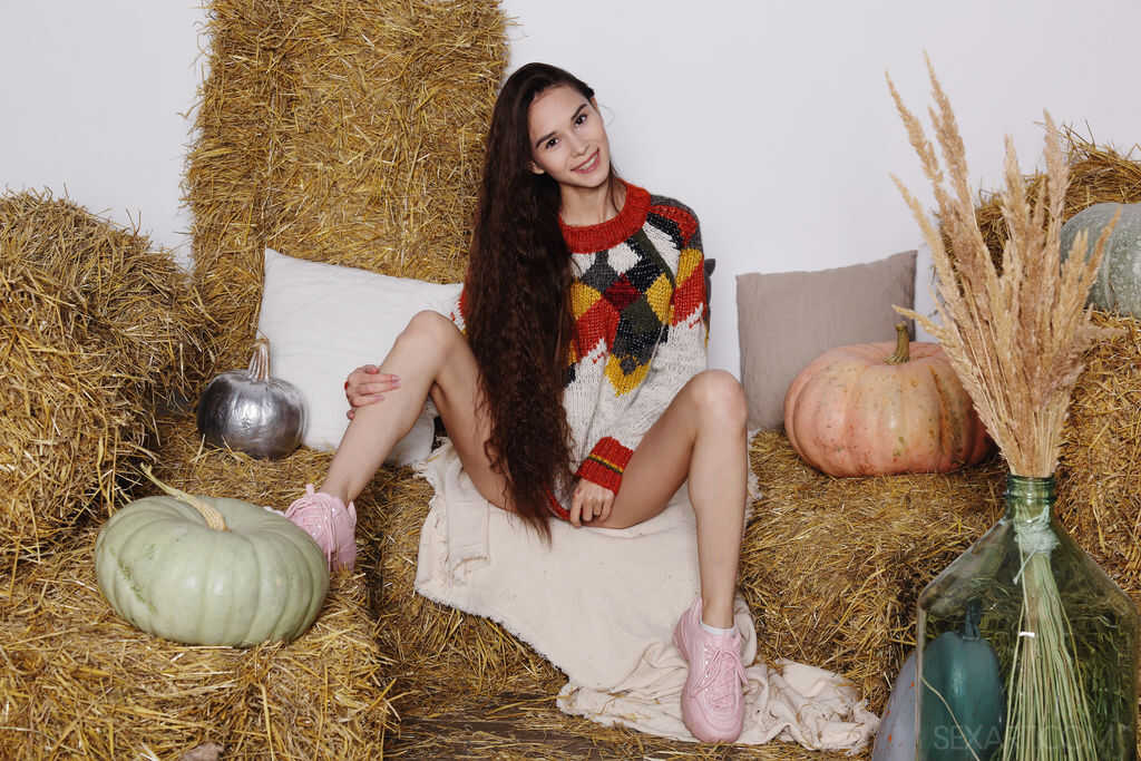 Leona Mia's Nude Harvest: Skinny Teen on Bales of Straw Exposes Her Open Teen Pussy - Leona Mia
