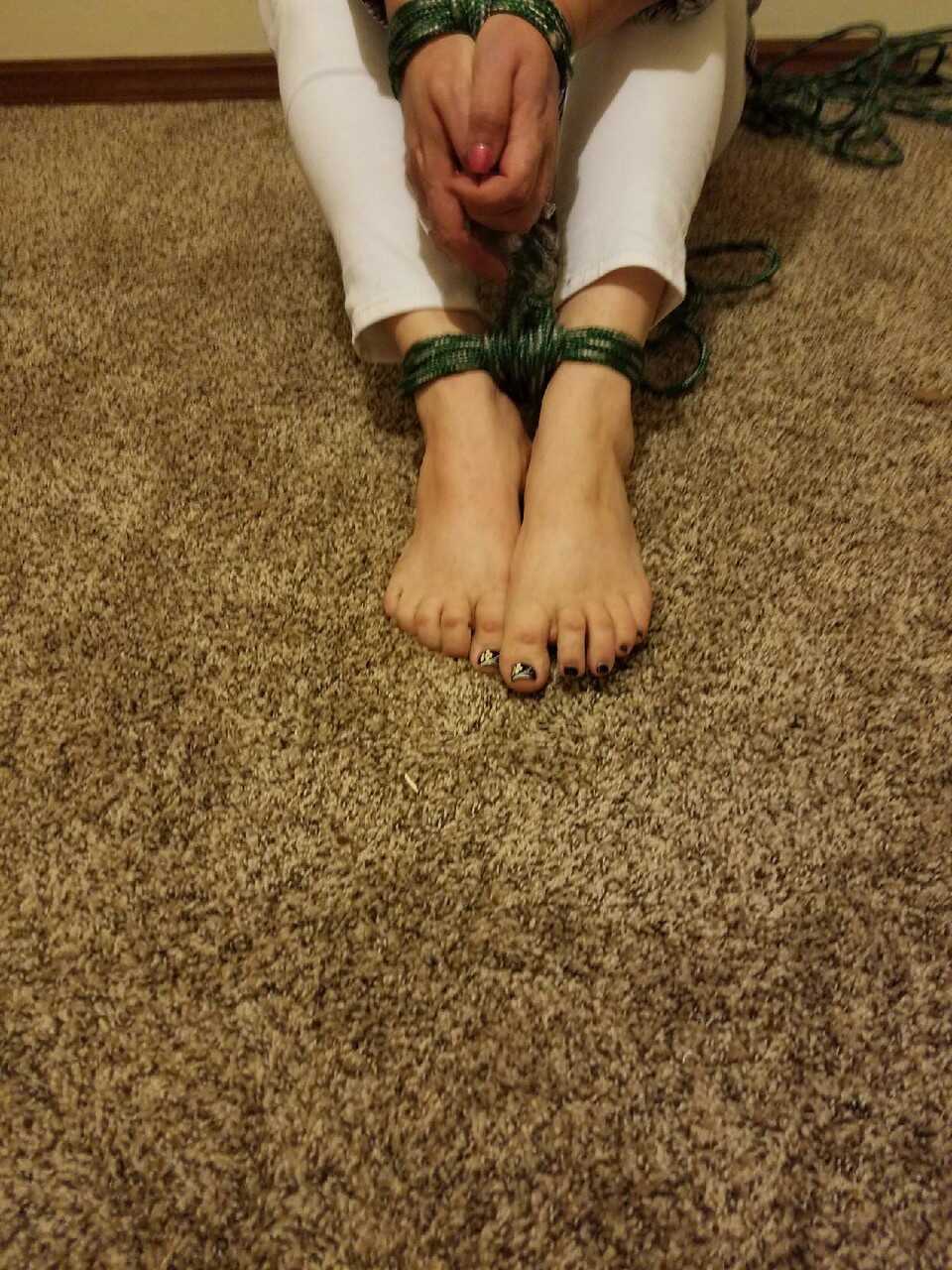 Caught in the act: Pretty Caucasian female's bare feet get spotted while she's tied up and exposed - 