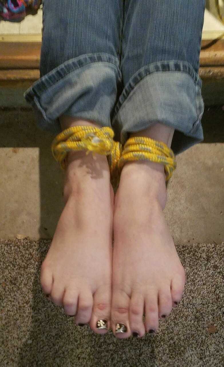 Caught in the act: Pretty Caucasian female's bare feet get spotted while she's tied up and exposed - 