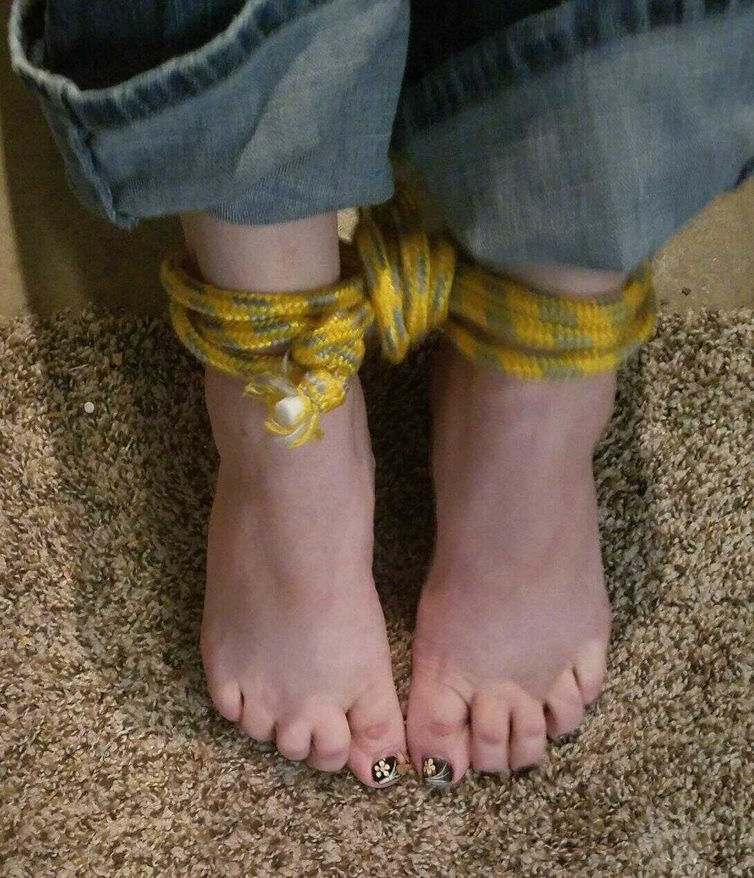 Caught in the act: Pretty Caucasian female's bare feet get spotted while she's tied up and exposed - 