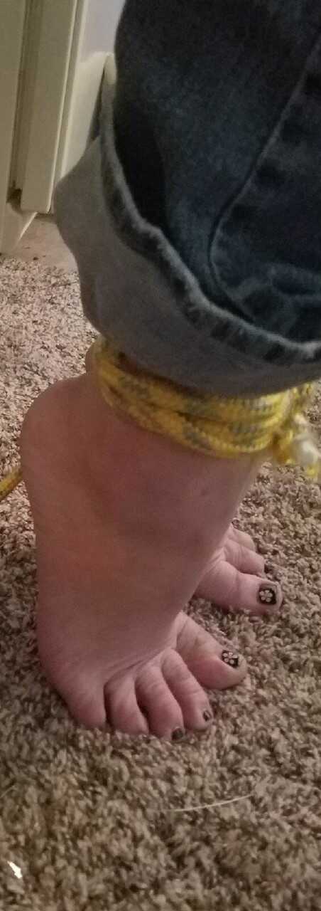 Caught in the act: Pretty Caucasian female's bare feet get spotted while she's tied up and exposed - 
