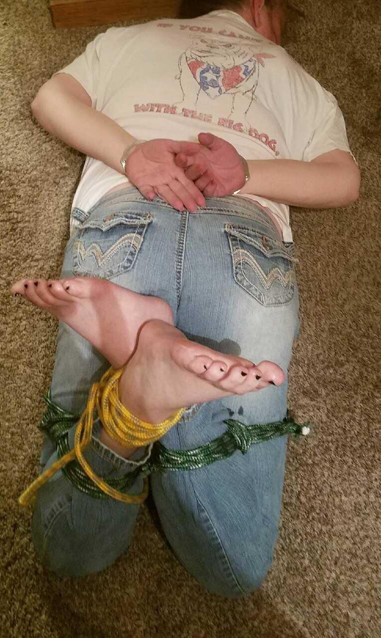 Caught in the act: Pretty Caucasian female's bare feet get spotted while she's tied up and exposed - 