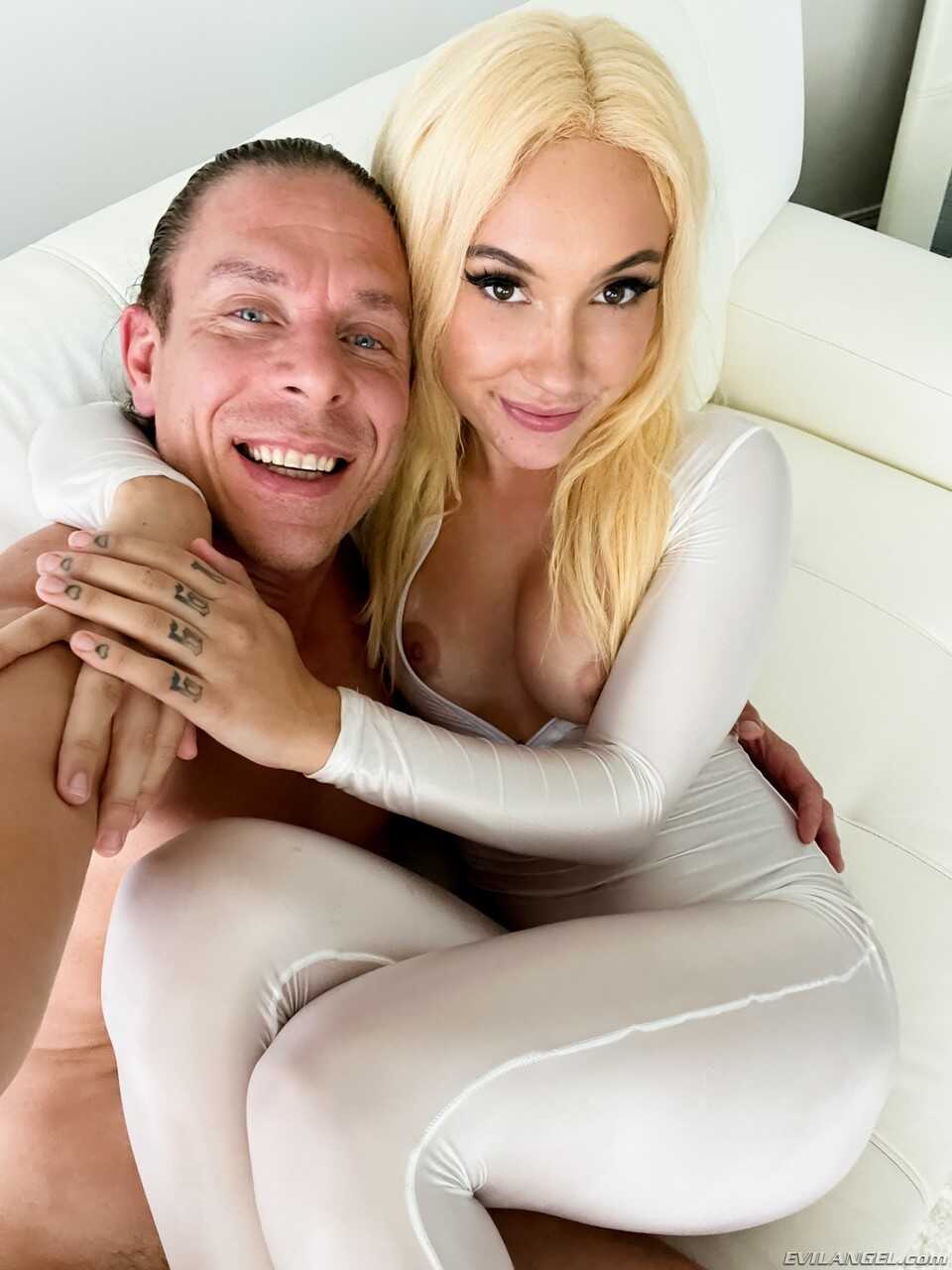 Sexy blonde Jazmin Luv unzips a white bodystocking during POV sex with Mick Blue’s big ass dog